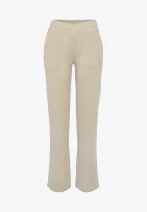 Kremaste trenerke s elastičnom strukom i dva bočna džepa. Izrađene od mekanog materijala s opuštenim širim dizajnom.