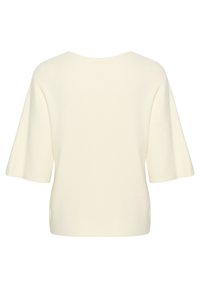 Cream-colored, short-sleeve top made of a smooth knit fabric with a rounded neckline and relaxed fit, featuring a clean, minimalist design.
