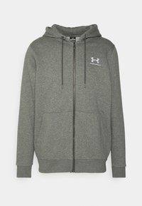 Felpa grigia con zip realizzata in tessuto morbido. Presenta un cappuccio con cordino, tasche frontali e un piccolo logo bianco sulla parte sinistra del petto.