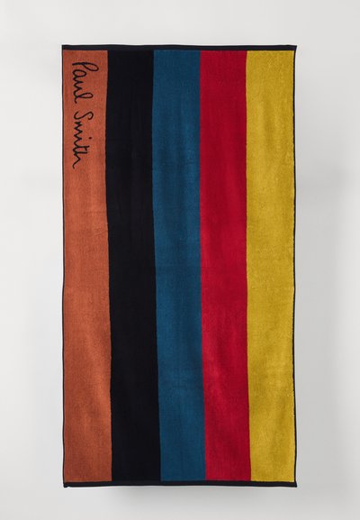 Cotton towel featuring bold vertical stripes in orange, black, blue, red, and yellow, with "Paul Smith" embroidered in black.