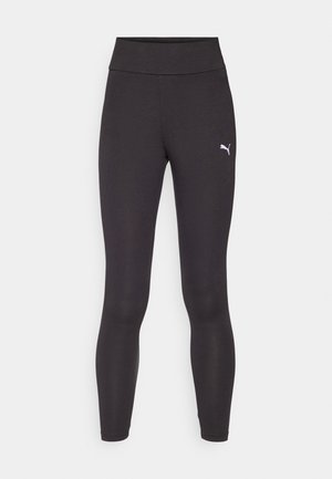 Svart leggings med høy midje, laget av stretchstoff. Har en liten hvit Puma-logo på øvre venstre ben. Slim fit design.