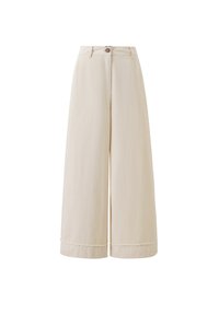 Pantalons larges en coton beige avec une texture lisse, présentant une fermeture à bouton à l'avant et un détail d'ourlet brut.