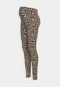 Leggings à imprimé léopard avec un fond beige, présentant des taches noires et brunes. Fabriqués en tissu extensible, conçus pour épouser la silhouette.