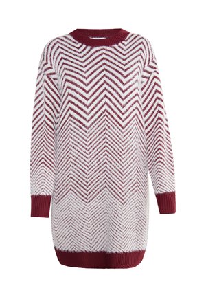 Ilgųjų rankovių megztinis su raudonos ir baltos spalvų zigzaginiu raštu, apvalia iškirpte, su gumuotomis rankovėmis ir apačia. Minkšta tekstūra, laisvas siluetas.