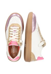White sneakers with pink accents, glittery detailing, perforations, gold hardware, and a textured beige side panel. Features traditional lacing.