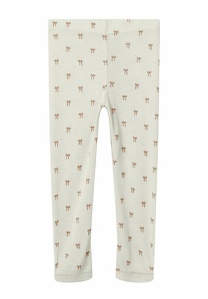 Leggings beige chiaro in morbido tessuto, con un motivo ripetuto di piccoli fiocchi marroni. Design aderente con una vita elasticizzata.