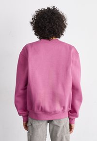 Carhartt WIP Felpa - magenta/black