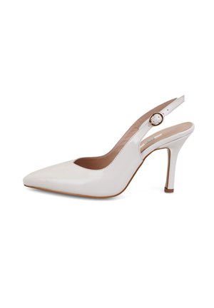 White patent leather slingback high-heeled shoe with pointed toe, featuring a cutout design and circular metal accent on the strap.