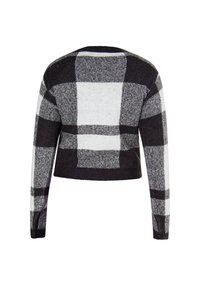 Afskåret sweater med et sort, hvidt og gråt ternet mønster, lange ærmer og en ribbet kant. Tekstureret strikmateriale.