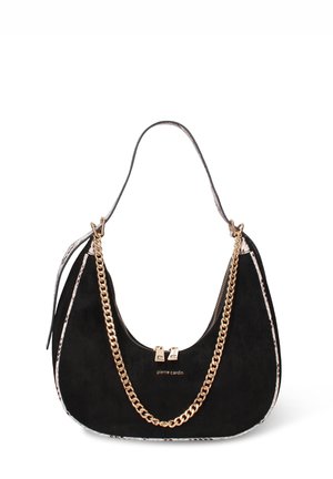 Black crescent-shaped handbag with gold chain detail, snake-pattern trim, and arched shoulder strap, featuring two gold zipper pulls.