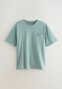 Lichtblauwe katoenen t-shirt met korte mouwen, ronde halslijn en een voorzakje. Gladde textuur en casual ontwerp.