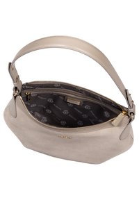Beige suede handbag with a smooth leather strap, gold hardware, and a patterned black interior lining. Open zipper reveals main compartment.