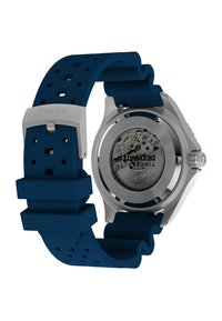 Zegarek Timex z stalową kopertą i granatowym silikonowym paskiem. Funkcje obejmują szkieletowe dno i wytrzymałą na wstrząsy konstrukcję.