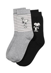 Due paia di calzini di cotone: una grigia a righe con design di Snoopy, l'altra nera uni con silhouette di Snoopy. Tessuto liscio, lunghezza alla caviglia.