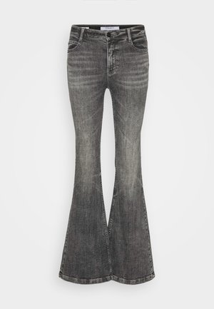 Flared black jeans in a faded wash, featuring a button and zipper closure, five pockets, and a structured denim texture.