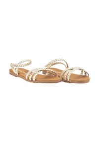 Sandalias trenzadas doradas con suelas planas y diseño de punta abierta, que cuentan con múltiples tiras cruzadas sobre una base marrón. Textura suave con detalles mínimos.