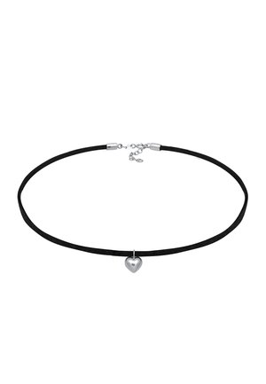 Black suede choker with a silver heart pendant. Features a clasp closure and adjustable length. Smooth texture and minimalist design.