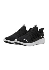 Scarpe da ginnastica nere con tomaia in rete, lacci elastici e suola bianca. Presentano un logo prominente e un motivo testurizzato sul tessuto.