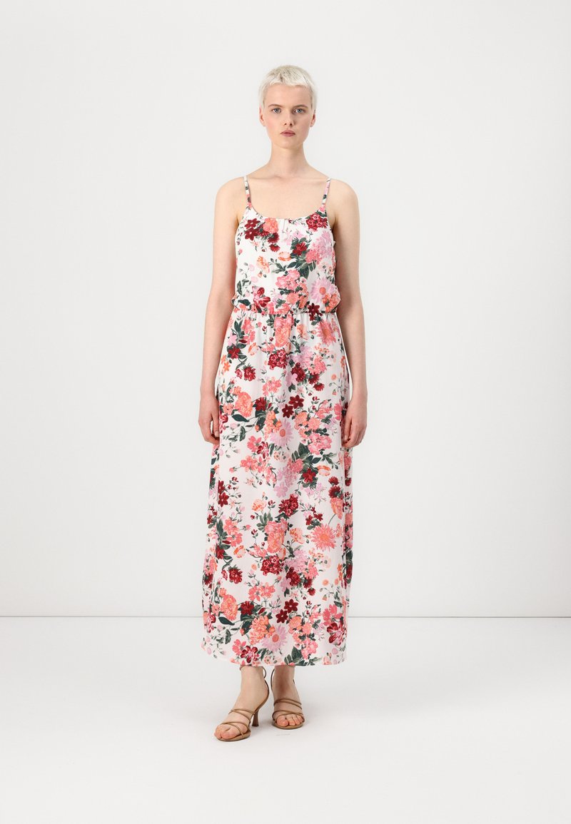 Floral maxi dress with thin straps, featuring pink, red, and green patterns on a white background. Lightweight fabric and relaxed fit.