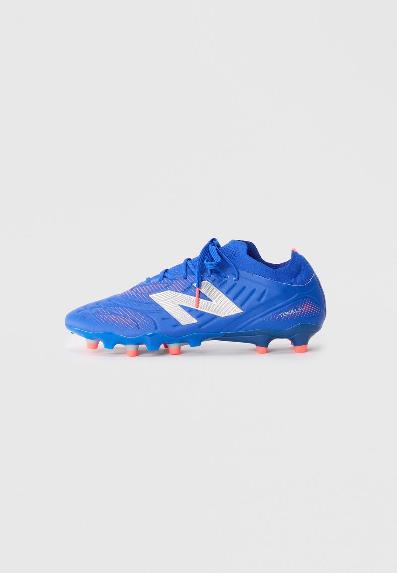 Blue soccer cleat with a textured surface, white accent logo, and orange studs. Features a lace-up design and a snug fit.