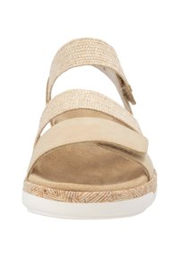 Beige sandaal met twee gevlochten banden en een brede suède band. Getextureerd platform met een kurkpatroon bovenop een witte zool.