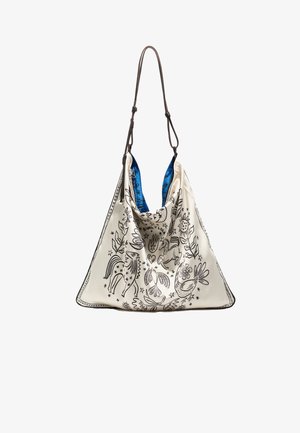 Biała skórzana torba z czarnymi, ilustrowanymi wzorami zwierząt i roślin, z niebieskim wnętrzem i brązowym paskiem. Obszerny, luźny kształt.