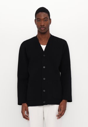 Black cardigan with a V-neckline, six-button front closure, and two front pockets. Made from textured fabric, featuring long sleeves.