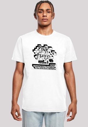 White cotton t-shirt featuring a graphic design with black text and a brick wall pattern. The text reads "Pink Floyd" and track titles.
