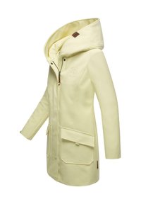 Light yellow waterproof jacket with a large hood, zip closure, two front pockets, and a textured fabric. Features a logo on one side.