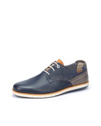 Navy leather shoes with a smooth finish, white sole, orange accent near the eyelets, and striped inner lining. Features stitching and tonal shades.