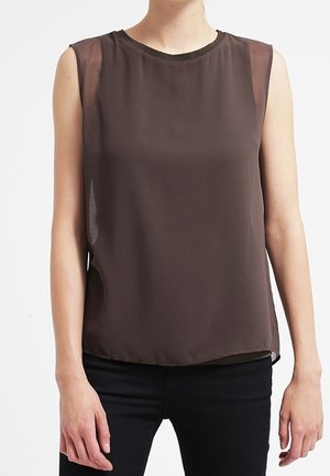 Sleeveless brown sheer blouse with round neckline worn with black pants, shown from shoulders to hips.
