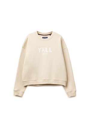 Beige Sweatshirt mit Rundhalsausschnitt, langen Ärmeln und gerippten Bündchen, vorne in der Mitte mit weißem Schriftzug "Y'ALL" bedruckt.