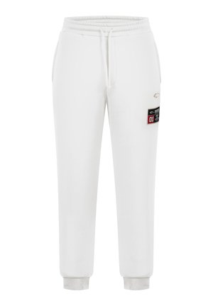 Pantaloni della tuta bianchi realizzati in un morbido misto cotone, con vita elasticizzata e cordoncino, gambe affusolate e una tasca laterale.