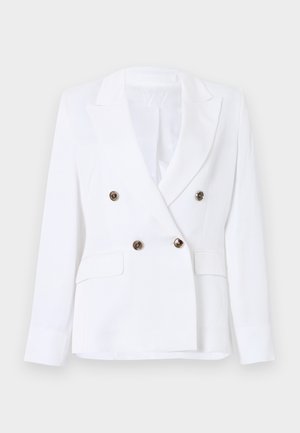Λευκό διπλόφτερο σακάκι με πέτο σε σχήμα νύχι, τέσσερα σκούρα κουμπιά, μακριά μανίκια και δύο εμπρόσθιες τσέπες με καπάκι.