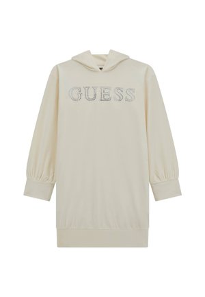 Robe à capuche de couleur crème avec de longues manches bouffantes, ornée d'un logo "GUESS" en strass sur le devant et d'un ourlet côtelé.