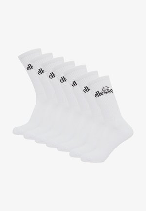 Ensemble de six chaussettes blanches en mélange de coton. Bords côtelés, logo noir, longueur moyenne. Texture lisse, design avec orteil et talon renforcés.