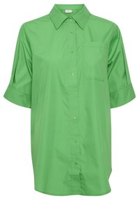 Grön kortärmad skjorta i slät tyg, med klassisk krage, framknäppning och bröstficka på vänster sida.