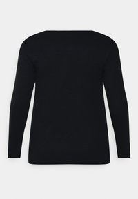 Camisola de manga longa preta feita de algodão suave. Apresenta um decote redondo, barra reta e um design simples sem padrões ou acentos.