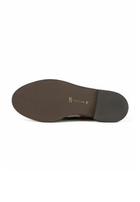 Semelle de chaussure marron avec une texture lisse, avant arrondi et talon légèrement surélevé. Présente des lettres en relief et une texture antidérapante au fond.
