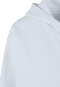 Light blue sweatshirt featuring a hood, soft texture, and a simple design without visible logos or patterns, showcasing a clean and minimal look.