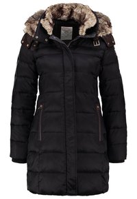 Svart pufferjacka med foder i päls, kviltat mönster, dubbla sidofickor med bruna accenter, och dragkedjestängning fram.