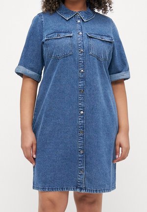 Denim shirt dress with a button-down front, short rolled sleeves, two chest pockets, and a classic collar. Light blue color and relaxed fit.