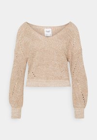 Pull en tricot court de couleur beige clair. Présente un décolleté en V profond, des manches larges et des détails en dentelle le long des coutures. Texture douce.