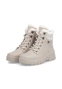 Beżowe skórzane botki za kostkę z futrzanym wykończeniem, sznurowana konstrukcja, zaokrąglony nosek oraz wzorzysta gumowa podeszwa zapewniająca przyczepność. Elementy metalowe obejmują oczka.