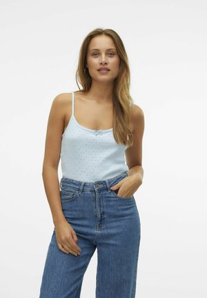 Light blue, sleeveless top with a small bow detail and eyelet patterns, paired with high-waisted, loose-fit blue denim jeans.