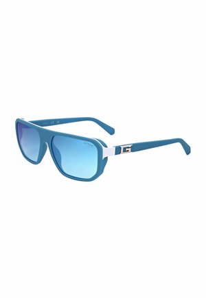 Occhiali da sole quadrati oversize blu con lenti sfumate blu e dettaglio argento con una "G" sull'asta.