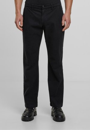 Pantalon en coton noir à coupe droite, avec une fermeture à bouton et à zip, des poches latérales et une texture lisse.