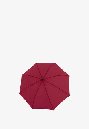 Parapluie rouge ouvert, vu de dessus, montrant huit baleines et un moyeu central noir.