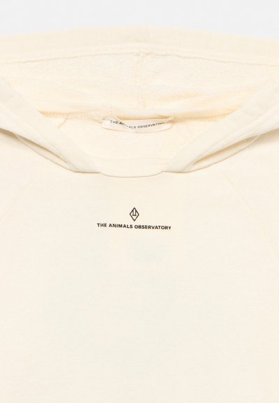 Sweat à capuche couleur crème avec le logo "THE ANIMALS OBSERVATORY" imprimé sous l'encolure et une étiquette assortie à l'intérieur du col.