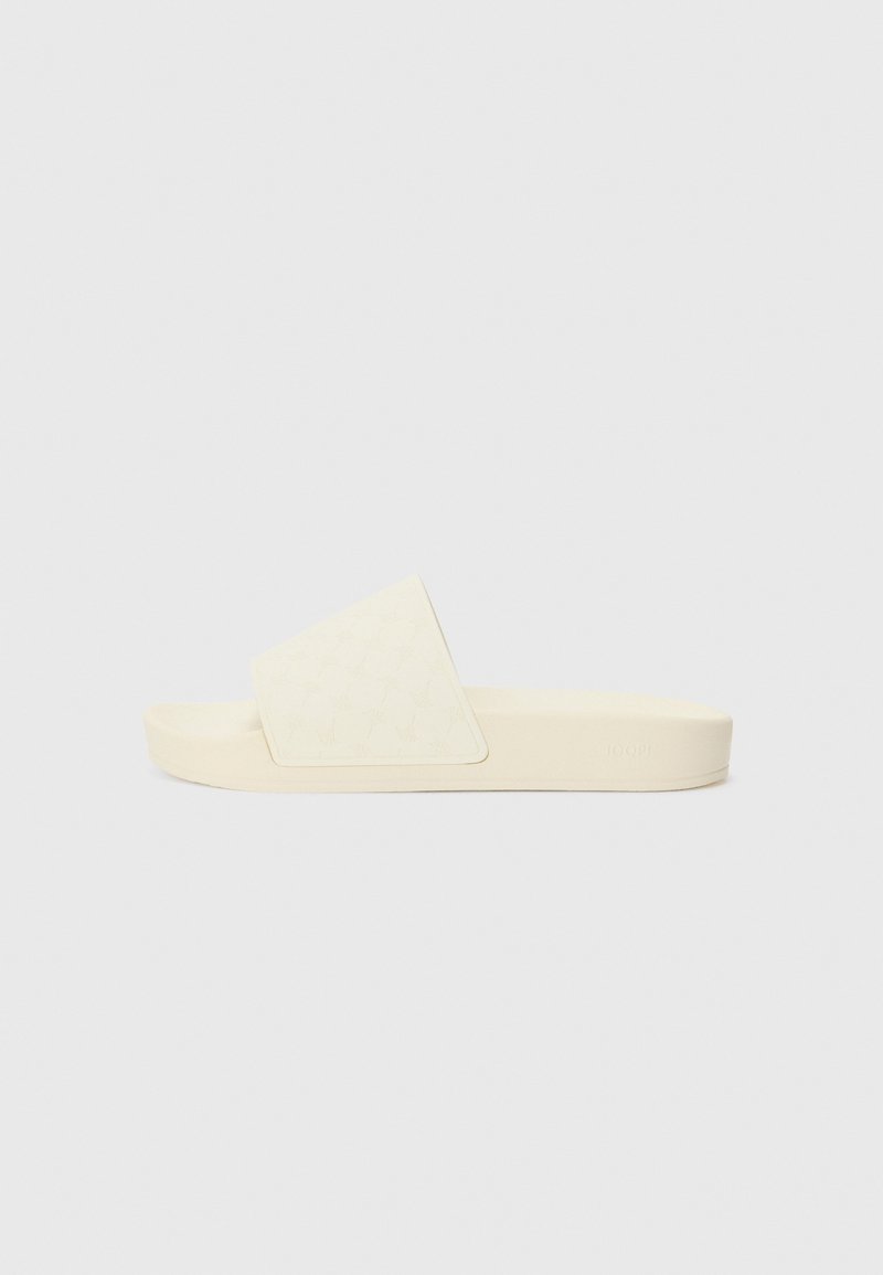 Sandale à glissière unique de couleur blanc cassé avec une semelle épaisse et une large bride texturée sur le dessus, présentée en profil sur un fond uni.